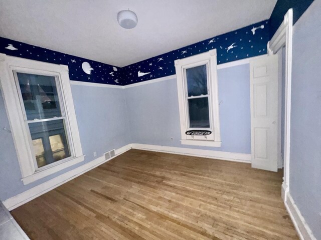 unfurnished bedroom featuring wood-type flooring