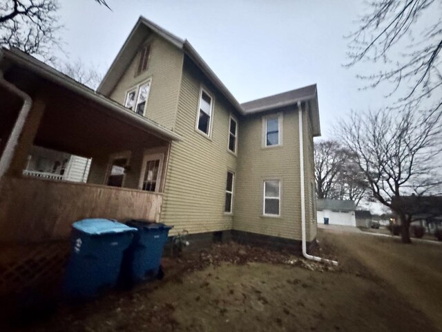 back of house with a sunroom