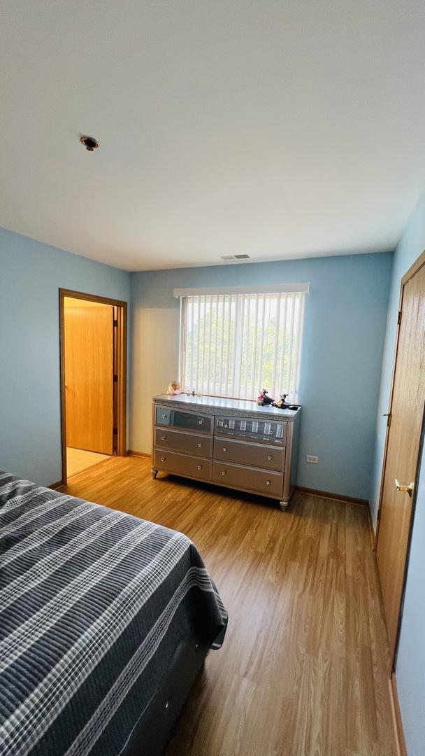 bedroom featuring light hardwood / wood-style flooring