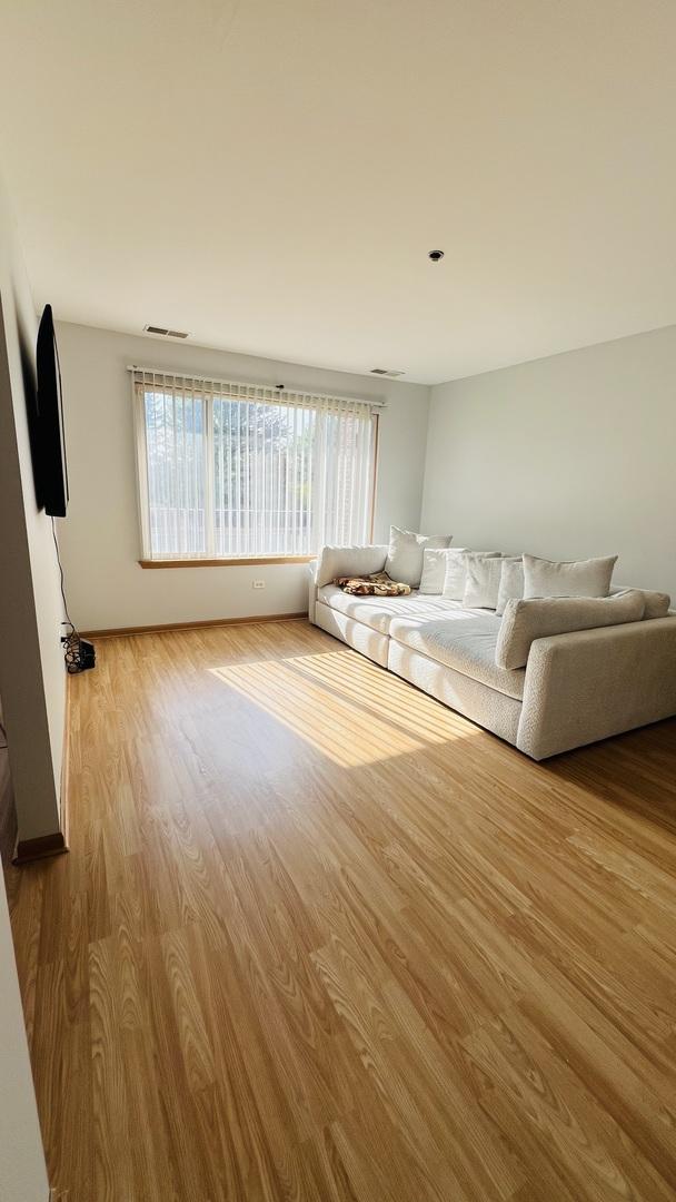 unfurnished living room with light hardwood / wood-style flooring