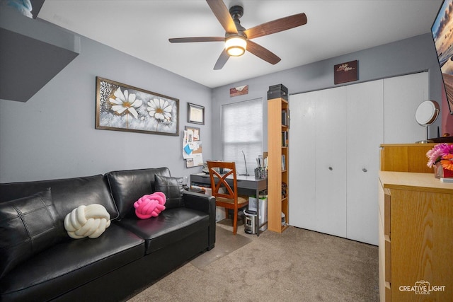 living room with light carpet and ceiling fan