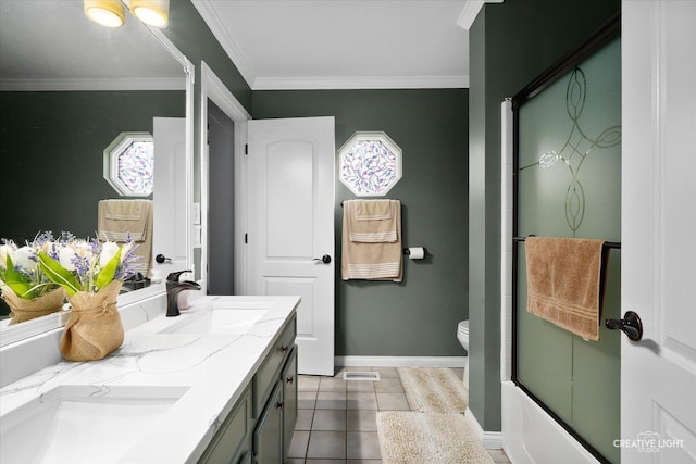 full bathroom featuring crown molding, combined bath / shower with glass door, tile patterned flooring, vanity, and toilet