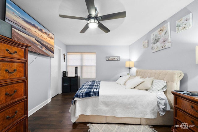 bedroom with dark wood-type flooring and ceiling fan