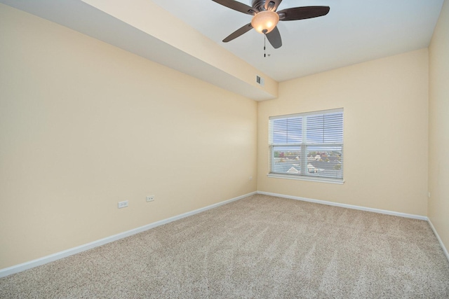 unfurnished room featuring ceiling fan and carpet flooring