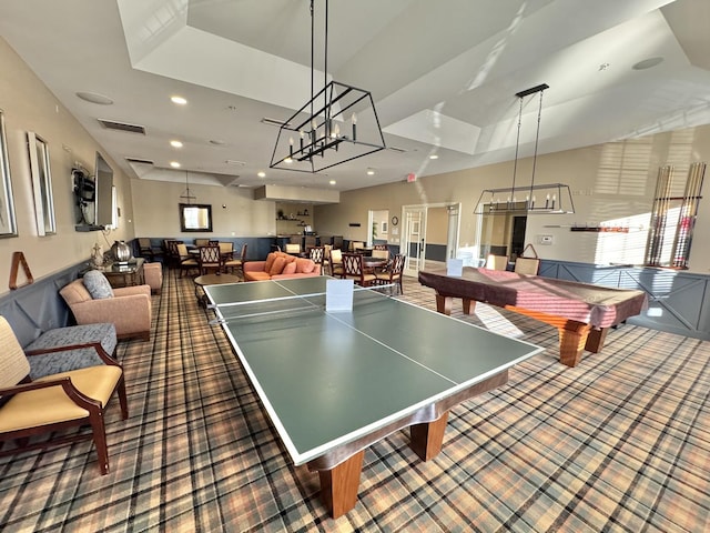 rec room featuring dark colored carpet, pool table, and a tray ceiling