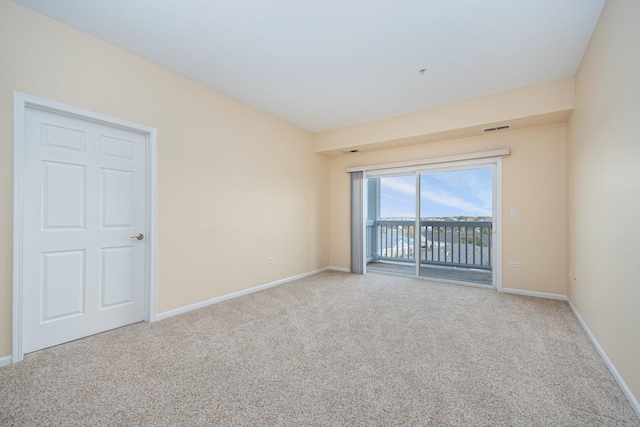 spare room featuring carpet floors