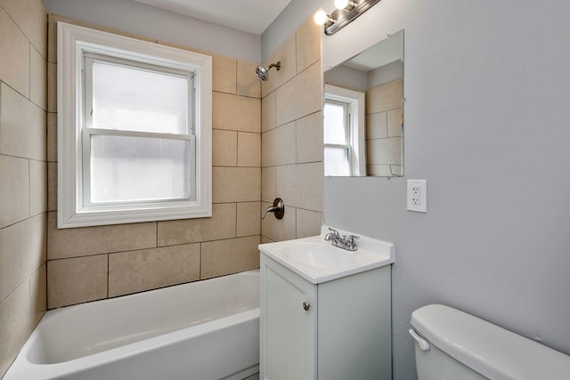 bathroom with toilet, shower / bath combination, and vanity