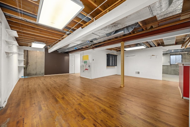 basement featuring hardwood / wood-style floors