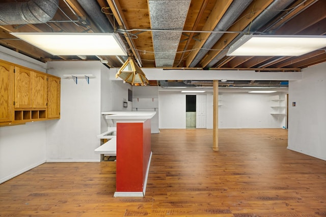 basement featuring hardwood / wood-style flooring