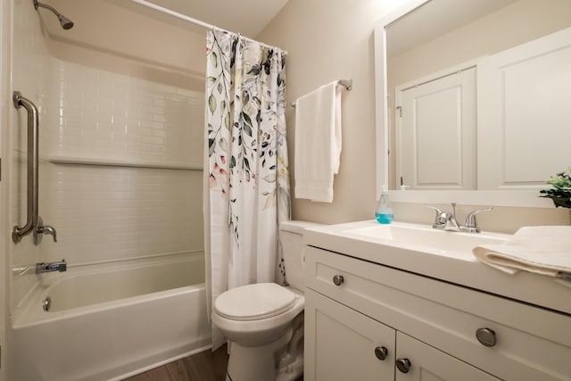 full bathroom with vanity, hardwood / wood-style floors, toilet, and shower / bath combo with shower curtain