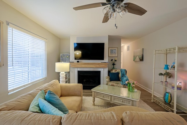 living room with hardwood / wood-style flooring and ceiling fan