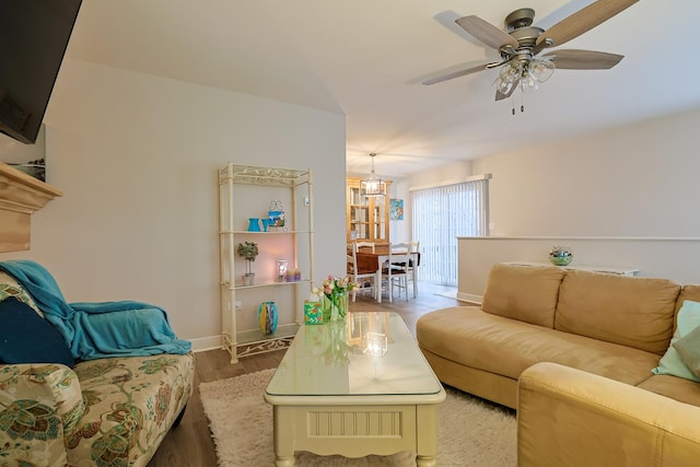 living room with ceiling fan and hardwood / wood-style floors