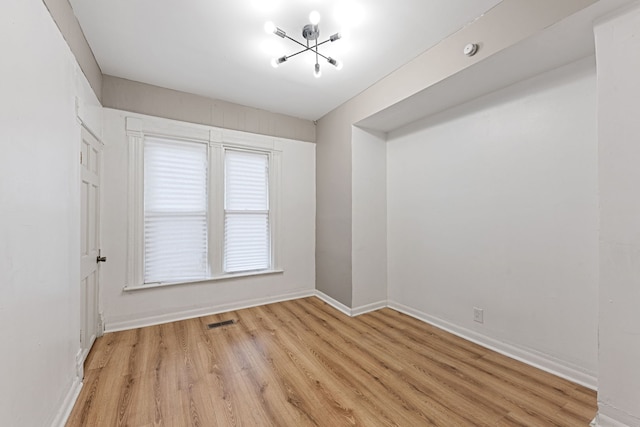 unfurnished room featuring light wood-type flooring