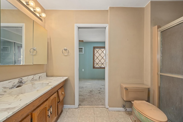 bathroom with vanity, an enclosed shower, tile patterned floors, and toilet