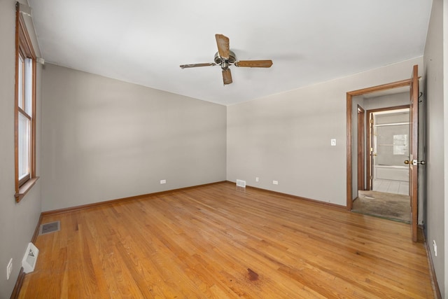 unfurnished room with ceiling fan and light hardwood / wood-style floors