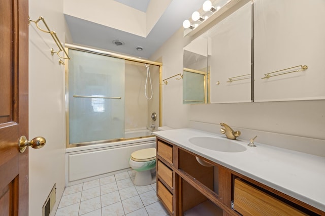 full bathroom with toilet, vanity, shower / bath combination with glass door, and tile patterned flooring