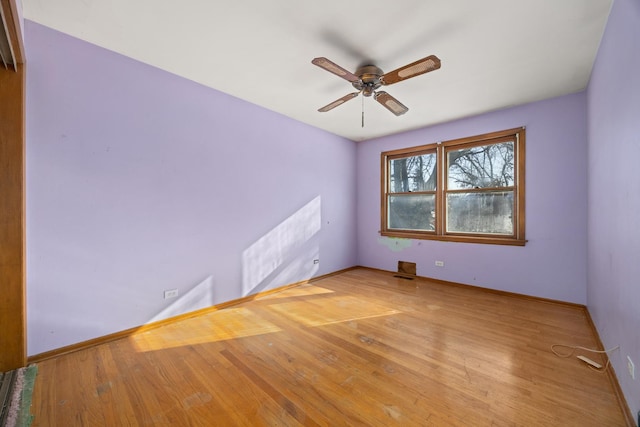 empty room with ceiling fan and light wood-type flooring