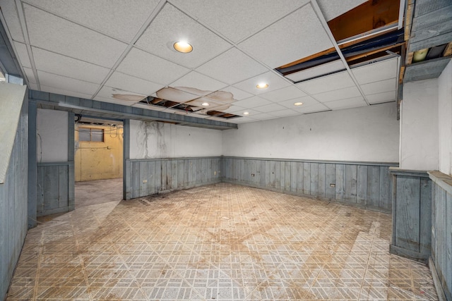 basement featuring a drop ceiling