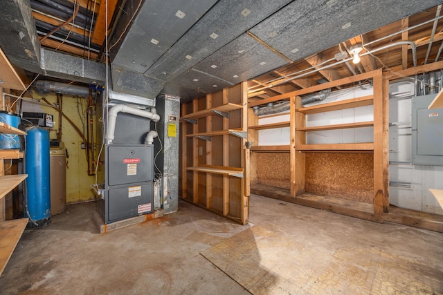 basement featuring electric panel and heating unit