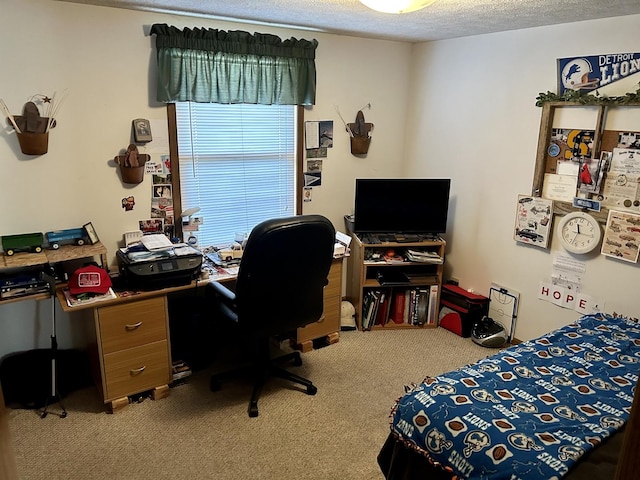 bedroom with a textured ceiling and carpet