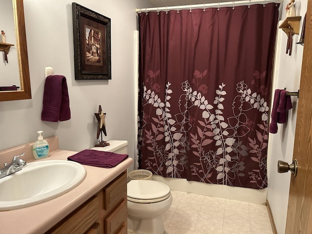 bathroom with tile patterned floors, toilet, and vanity