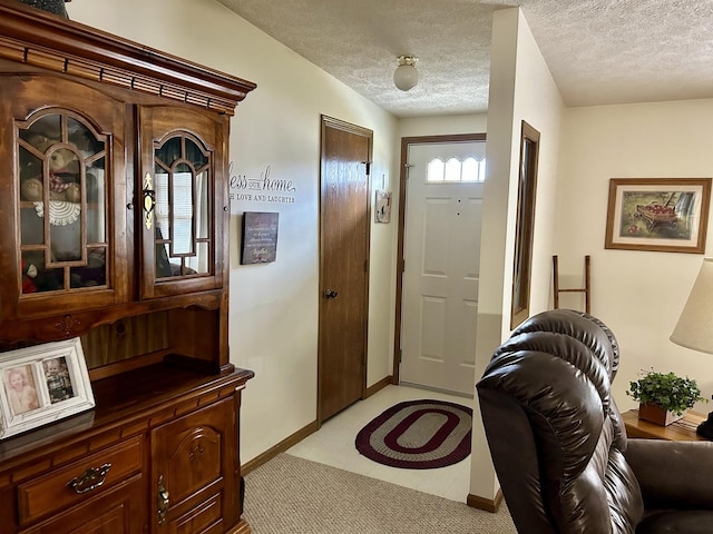 entrance foyer with a textured ceiling