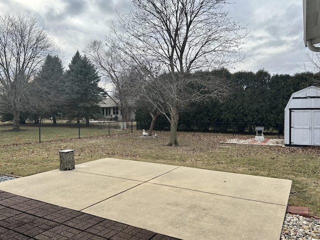 view of patio / terrace with a shed