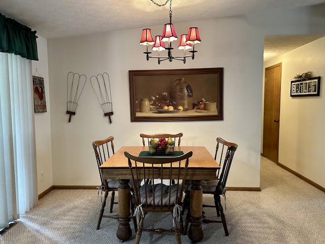 carpeted dining area featuring a textured ceiling