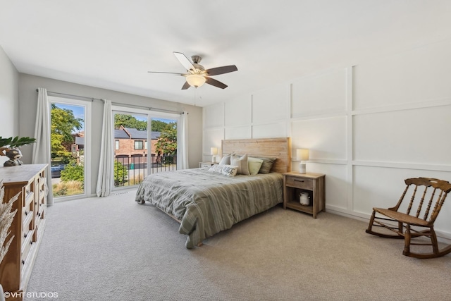 bedroom featuring ceiling fan, light carpet, and access to outside