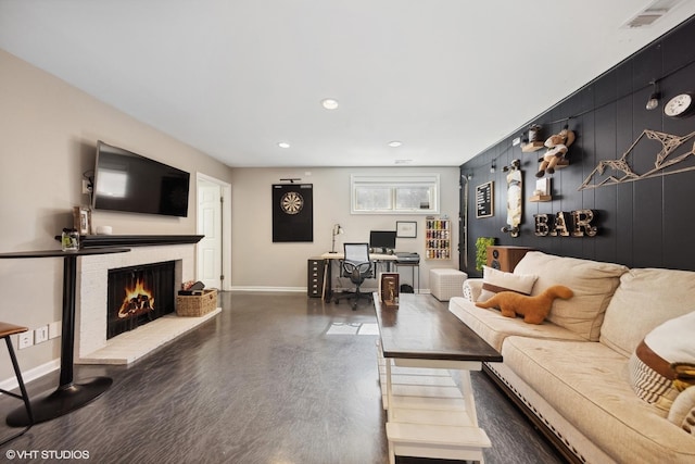 living room featuring dark hardwood / wood-style flooring and wood walls