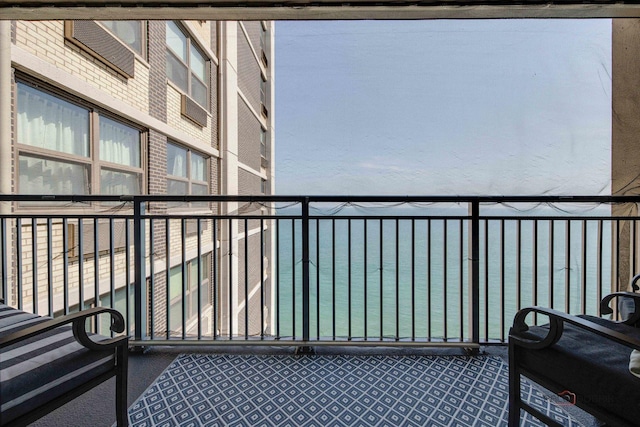 balcony featuring a water view