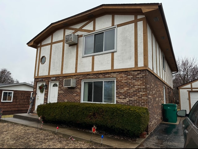 tudor-style house with a wall mounted AC