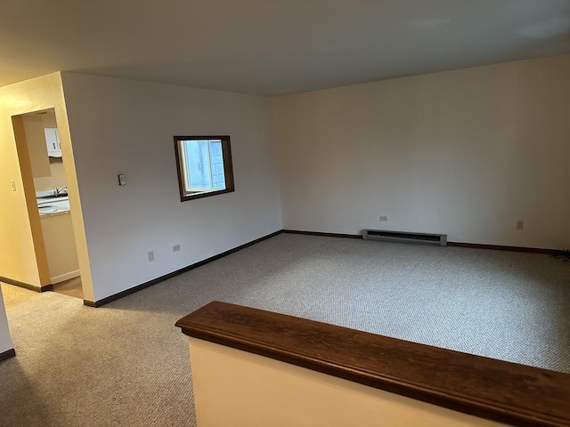 empty room featuring light carpet