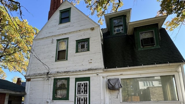 view of side of home featuring cooling unit