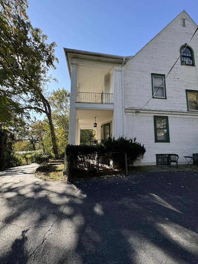 view of front of property with a balcony