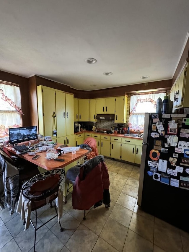 dining room with a workshop area and light tile patterned flooring