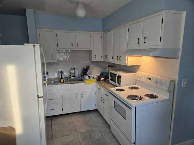 kitchen with tasteful backsplash, sink, white appliances, and white cabinets