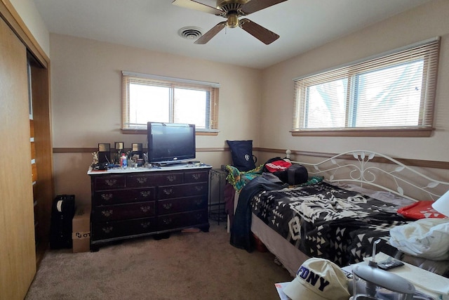 carpeted bedroom with ceiling fan