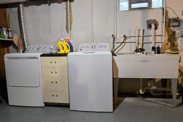 clothes washing area with sink and washing machine and dryer