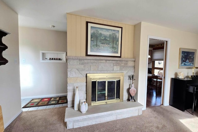 living room with a fireplace and light colored carpet