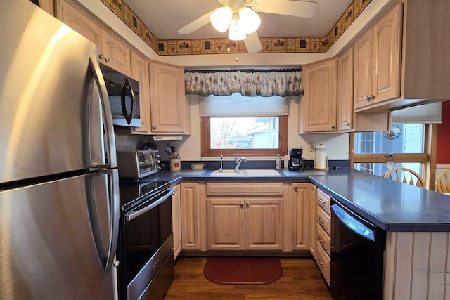 kitchen featuring sink, light brown cabinets, appliances with stainless steel finishes, dark hardwood / wood-style flooring, and ceiling fan