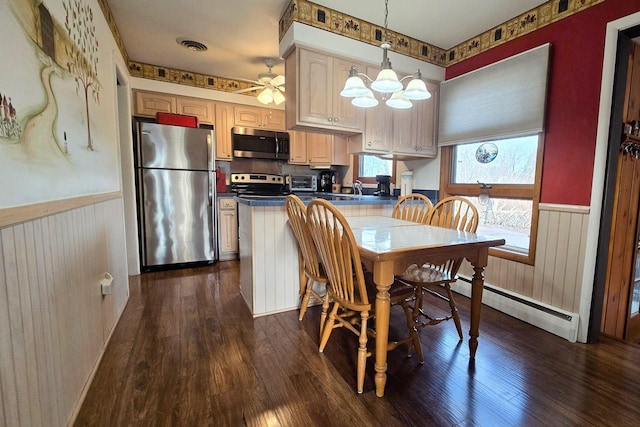 dining area with a notable chandelier, dark hardwood / wood-style floors, and baseboard heating