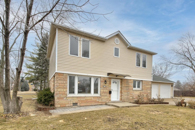 view of front of house featuring a garage and a front yard