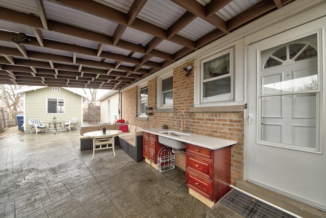 view of patio with outdoor lounge area and a wet bar