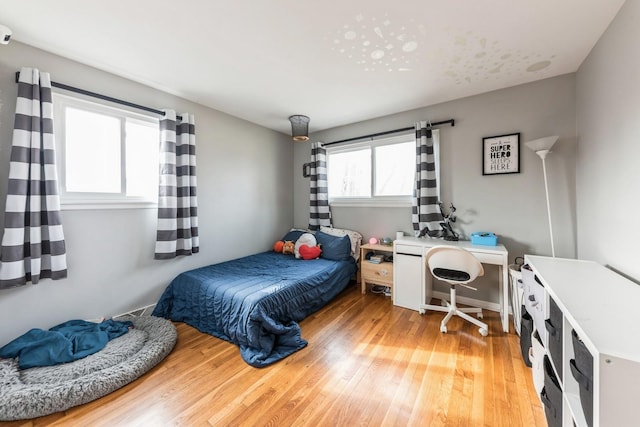 bedroom featuring wood finished floors