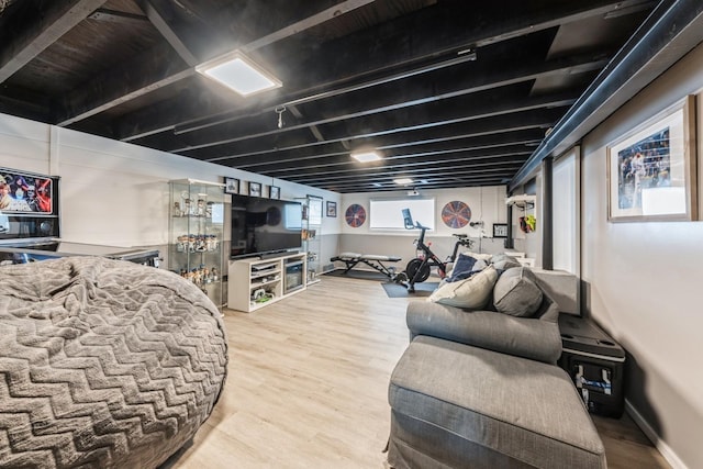 living room featuring wood finished floors and baseboards