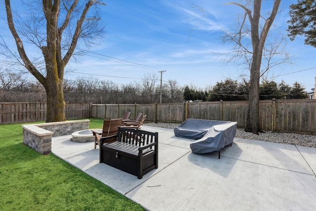 view of patio / terrace featuring a fenced backyard and a fire pit