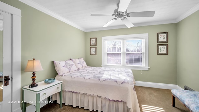 carpeted bedroom featuring ornamental molding and ceiling fan