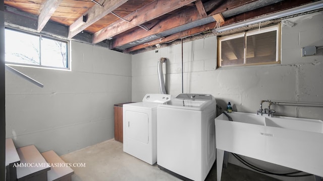 laundry room featuring washer and dryer and sink