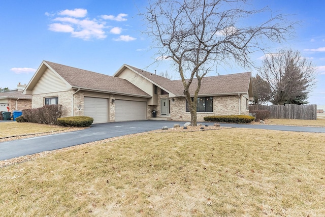 view of front of house with a garage and a front yard